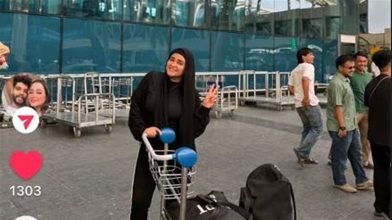 أرملة أمام صالة 3 بمطار القاهرة الدولى 