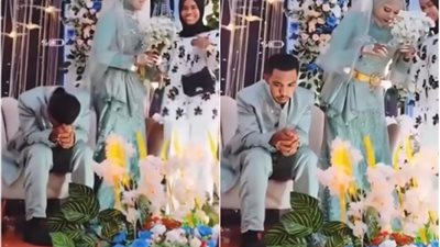 «كأنه مغصوب على الزواج»، عريس آسيوي يبدو في حالة غريبة ليلة زفافه (فيديو)